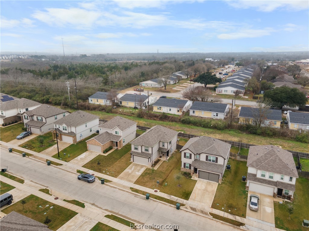 984 Crossing Drive Bryan, TX 77803 - Photo 27 of 29 an aerial view of a house with a lake view
