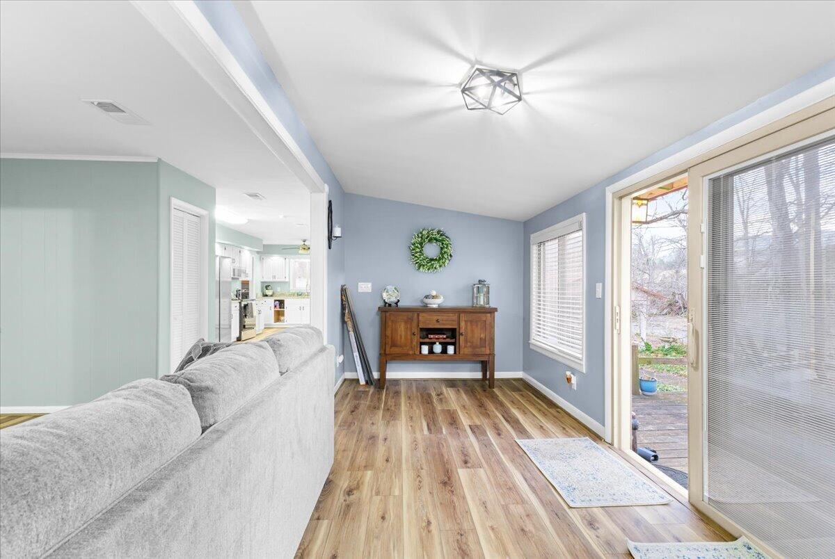 6742 Upper Craigs Creek Road Catawba, VA 24070 - Photo 11 of 23 a living room with furniture and a chandelier