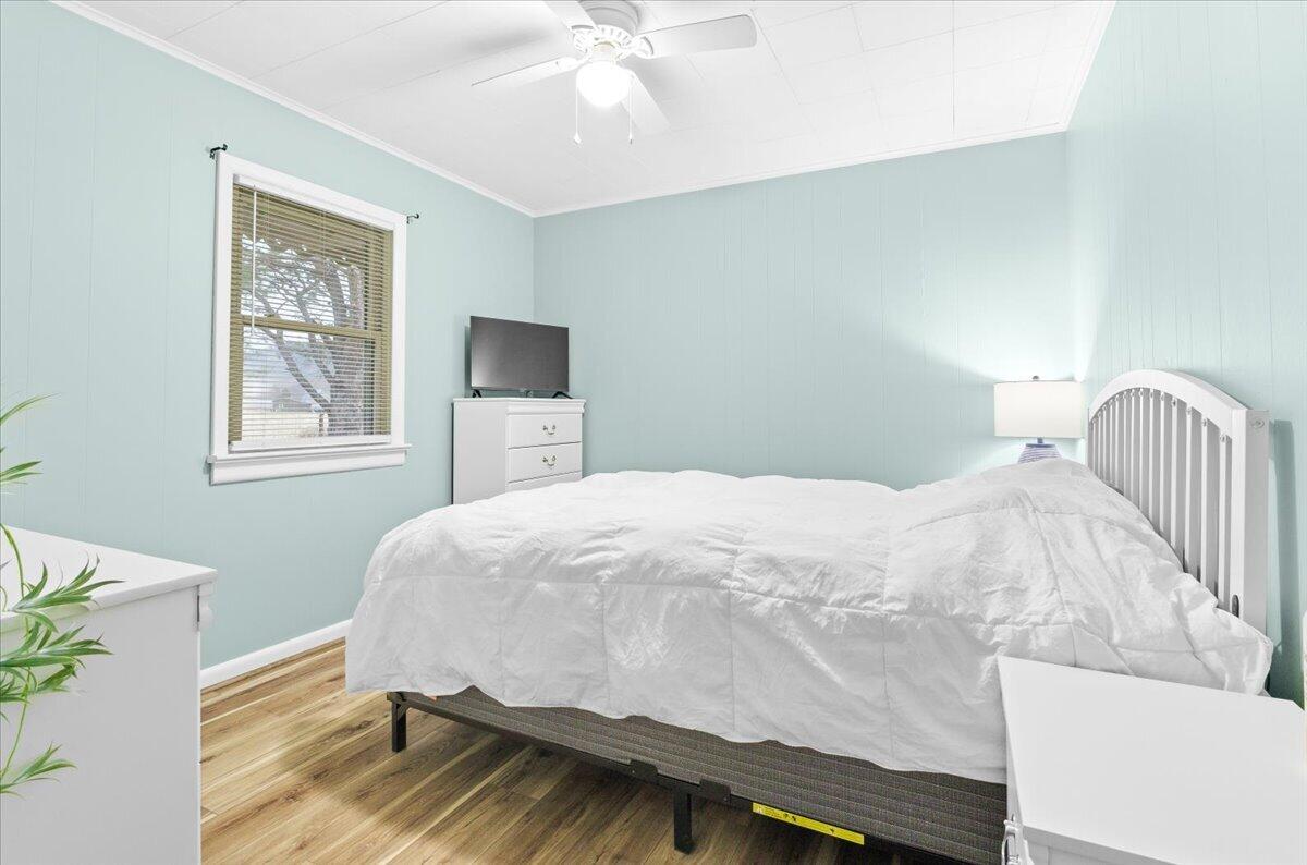 6742 Upper Craigs Creek Road Catawba, VA 24070 - Photo 16 of 23 a bedroom with a bed and wooden floor