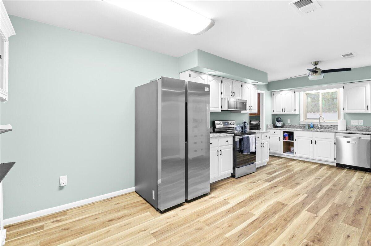 6742 Upper Craigs Creek Road Catawba, VA 24070 - Photo 17 of 23 a kitchen with granite countertop a refrigerator and a sink