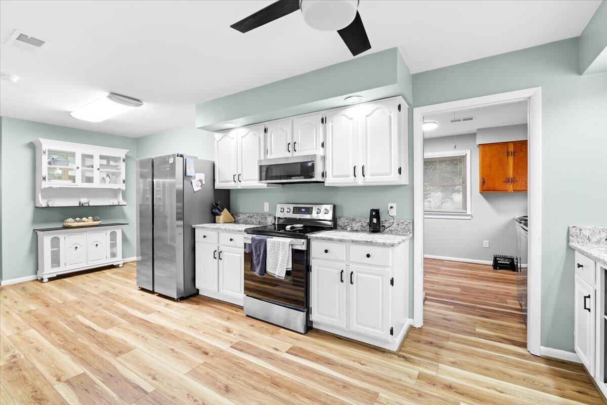 6742 Upper Craigs Creek Road Catawba, VA 24070 - Photo 21 of 23 a kitchen with stainless steel appliances a refrigerator sink and cabinets