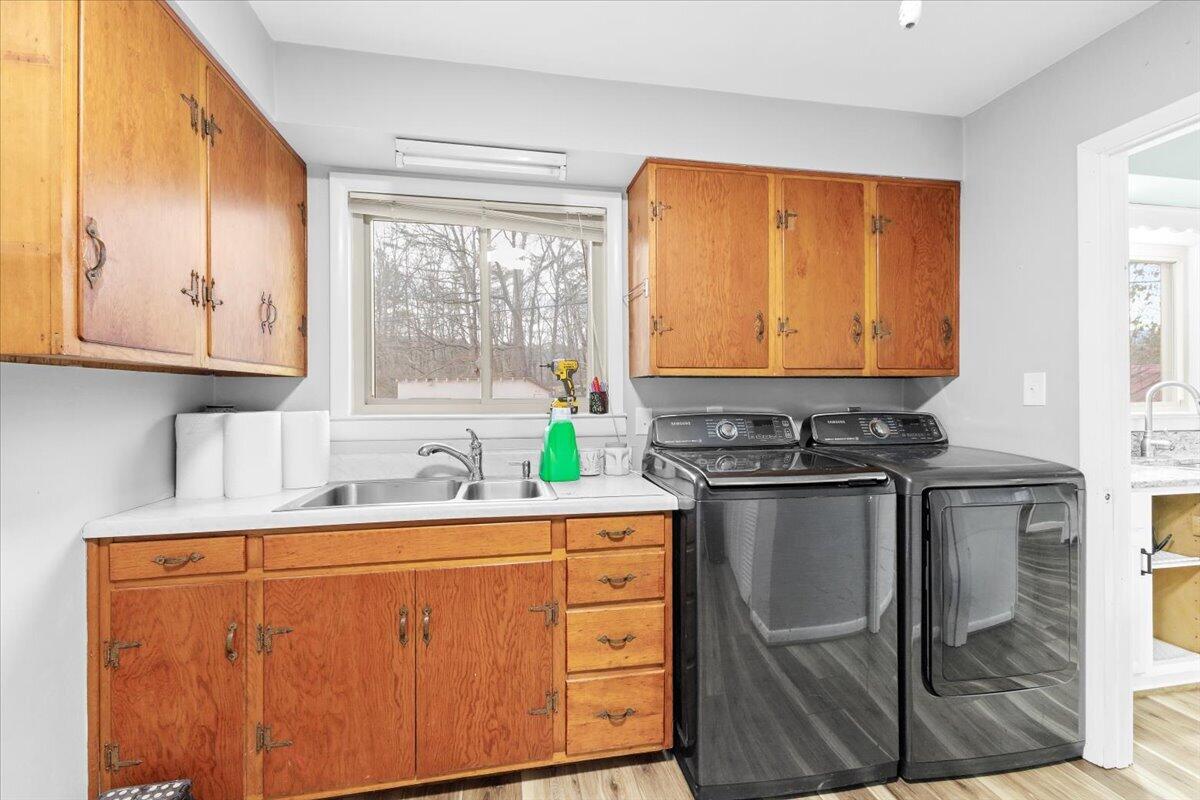 6742 Upper Craigs Creek Road Catawba, VA 24070 - Photo 22 of 23 a kitchen with stainless steel appliances granite countertop a stove a sink and a microwave