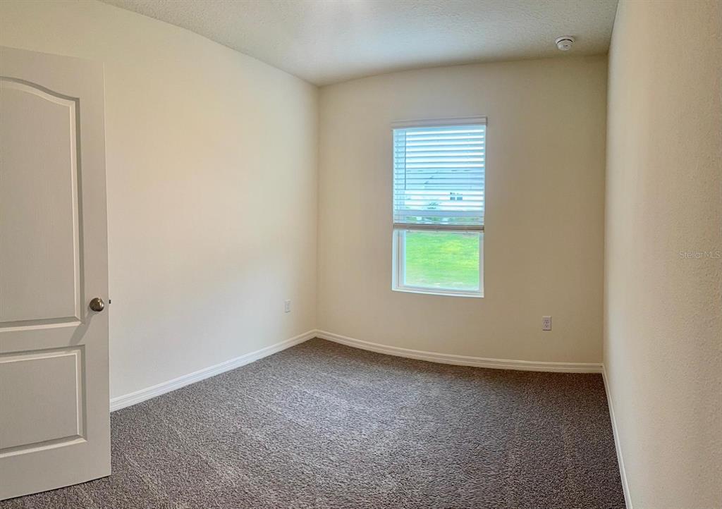 1642 Rock Elm Road Davenport, FL 33837 - Photo 14 of 27 an empty room with a window