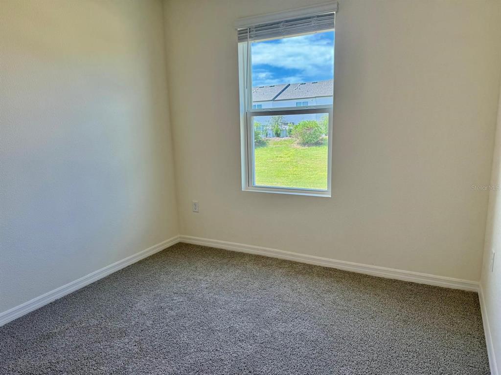 1642 Rock Elm Road Davenport, FL 33837 - Photo 15 of 27 an empty room with a window