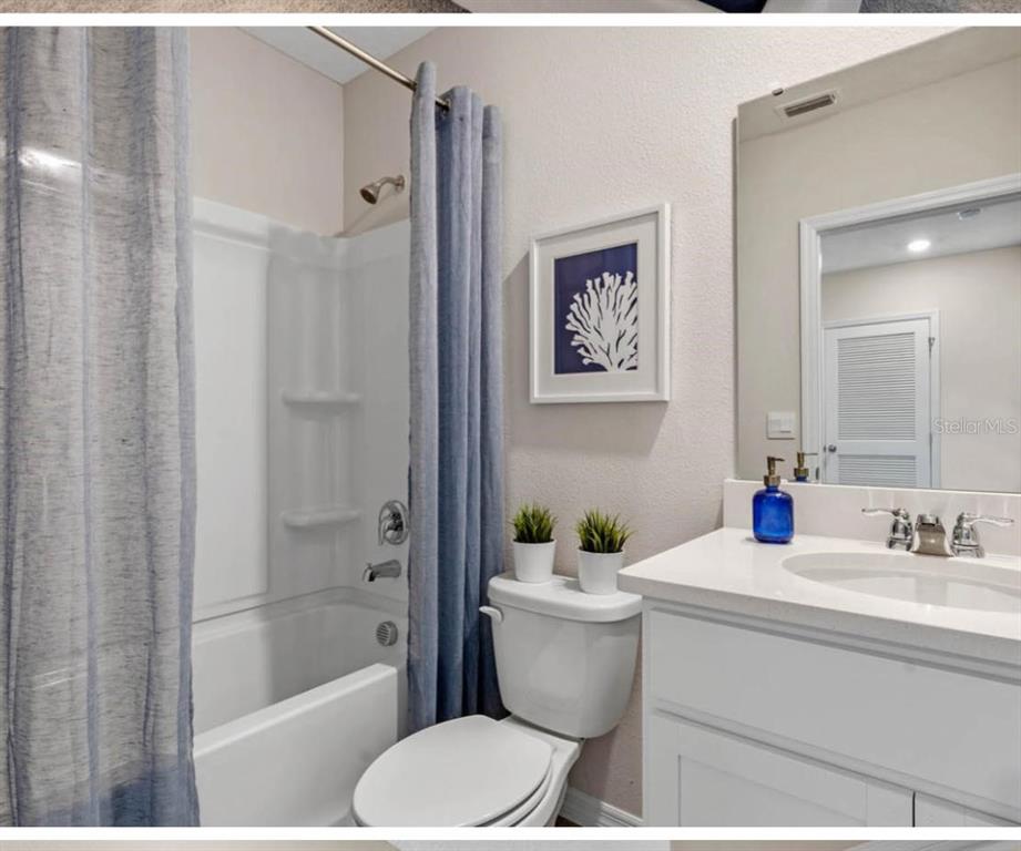 1642 Rock Elm Road Davenport, FL 33837 - Photo 22 of 27 a bathroom with a sink toilet and shower