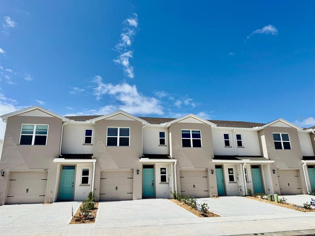 1642 Rock Elm Road Davenport, FL 33837 - Photo 27 of 27 a front view of a house with a garage