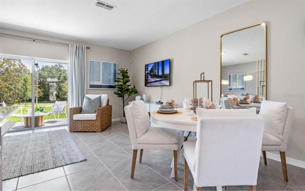 1642 Rock Elm Road Davenport, FL 33837 - Photo 4 of 27 a living room with furniture and a large window