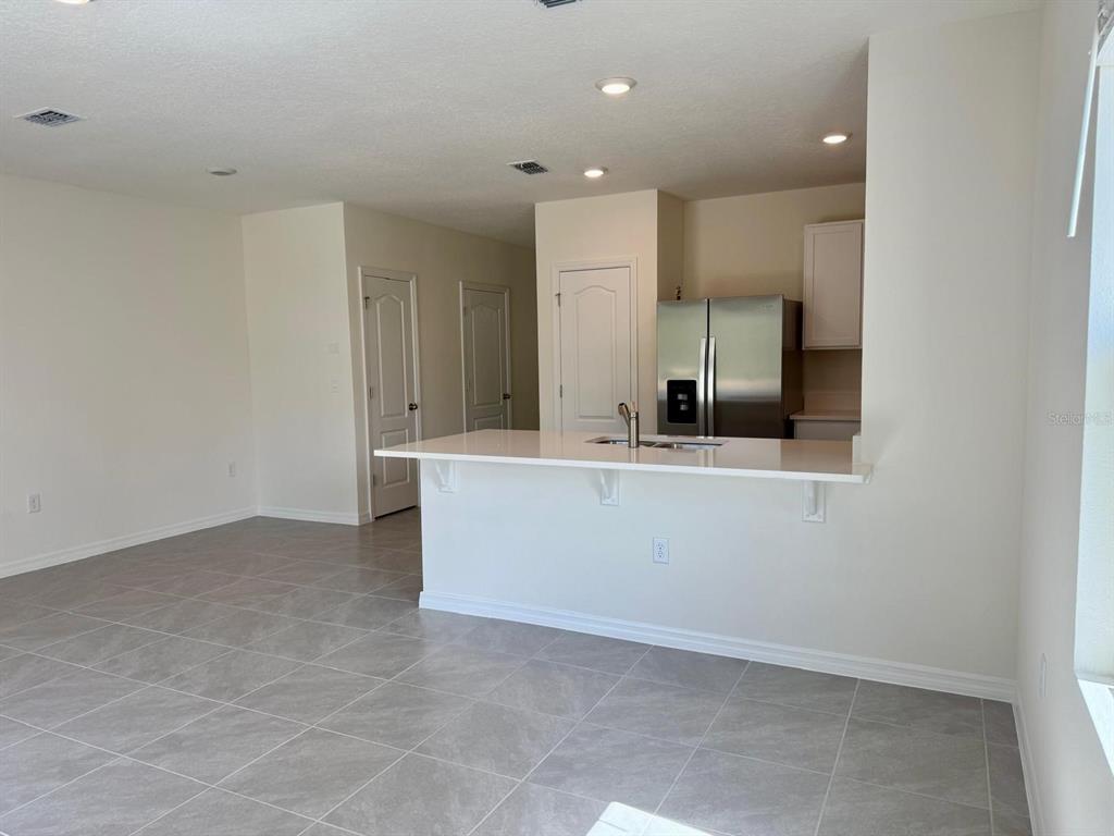 1642 Rock Elm Road Davenport, FL 33837 - Photo 10 of 27 a bathroom with a sink and a mirror