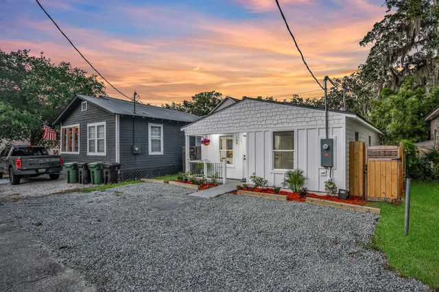 a front view of a house with garden