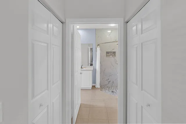 a bathroom with a shower and a sink