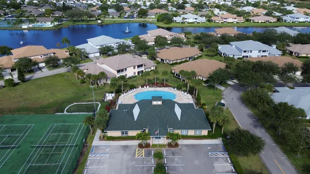 a green field with trees in the background