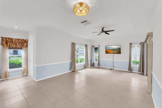 a view of an empty room and a window