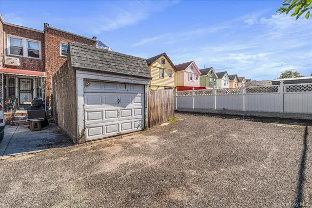 a view of a house with a yard and garage