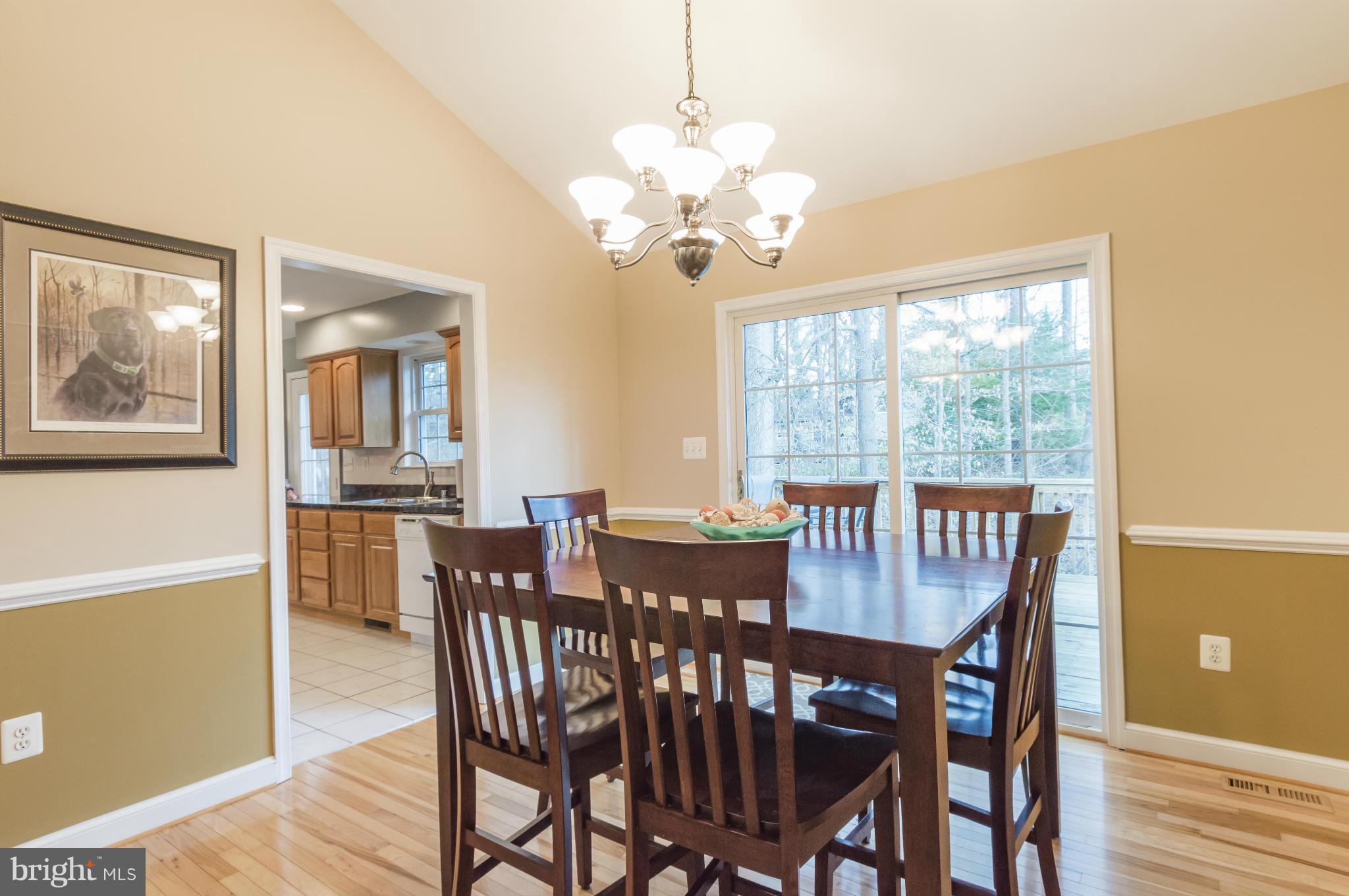 5912 Hillside Road St. Leonard, MD 20685 - Photo 8 of 30 Dining Area with slider to deck