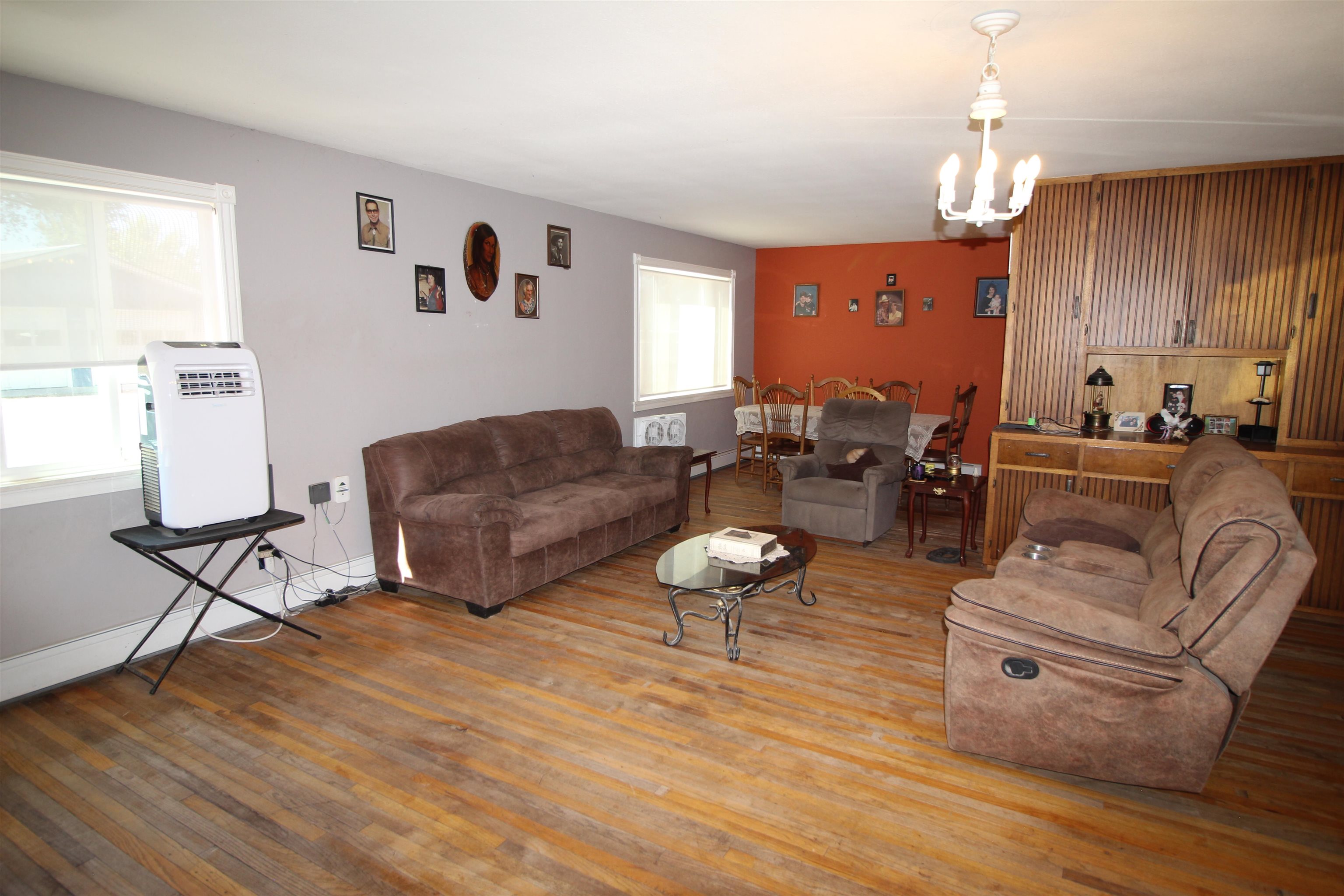 1150 East 7th Street Delta, CO 81416 - Photo 12 of 32 a living room with furniture and a chandelier