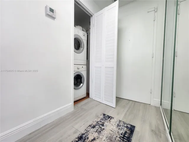 a view of a storage & utility room with a door