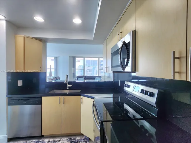 a large kitchen with a large window