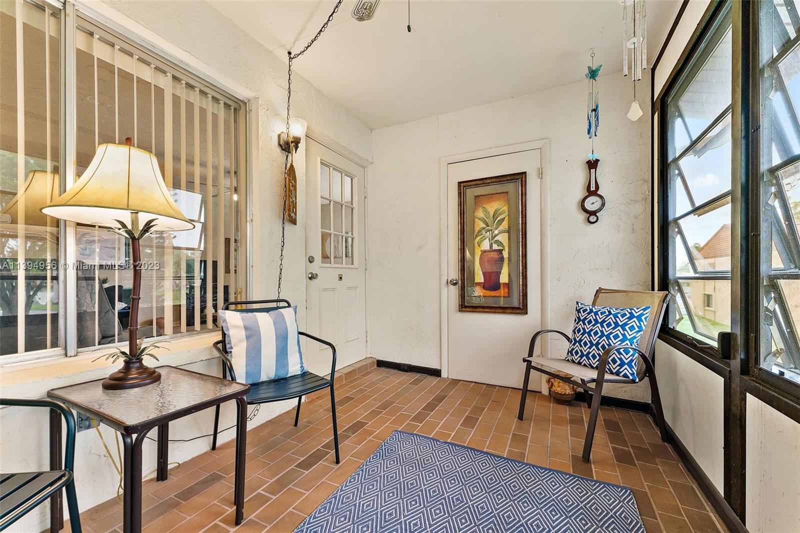 307 Pine Ridge Circle, Unit D2 Greenacres, FL 33463 - Photo 4 of 41 a view of a livingroom with furniture and window