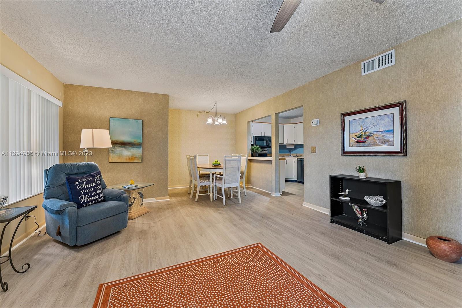 307 Pine Ridge Circle, Unit D2 Greenacres, FL 33463 - Photo 9 of 41 a living room with furniture and a fireplace