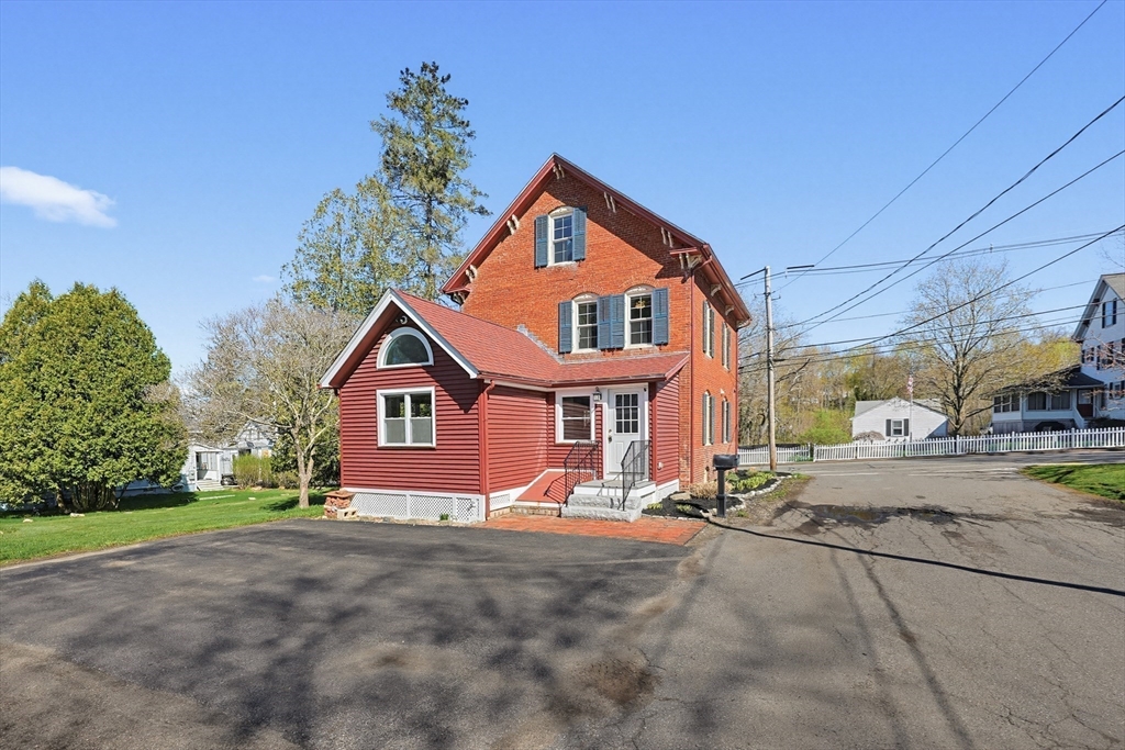 44 Clark Street Spencer, MA 01562 - Photo 39 of 41 a front view of a house with a yard