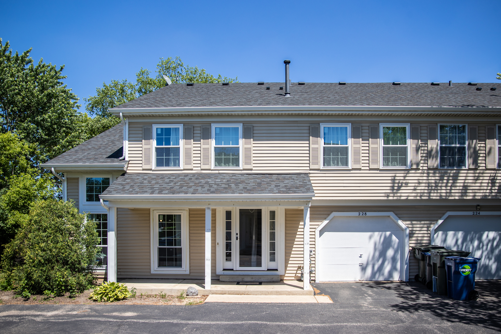 228 Butternut Lane Streamwood, IL 60107 - Photo 1 of 15 a front view of a house with a garage