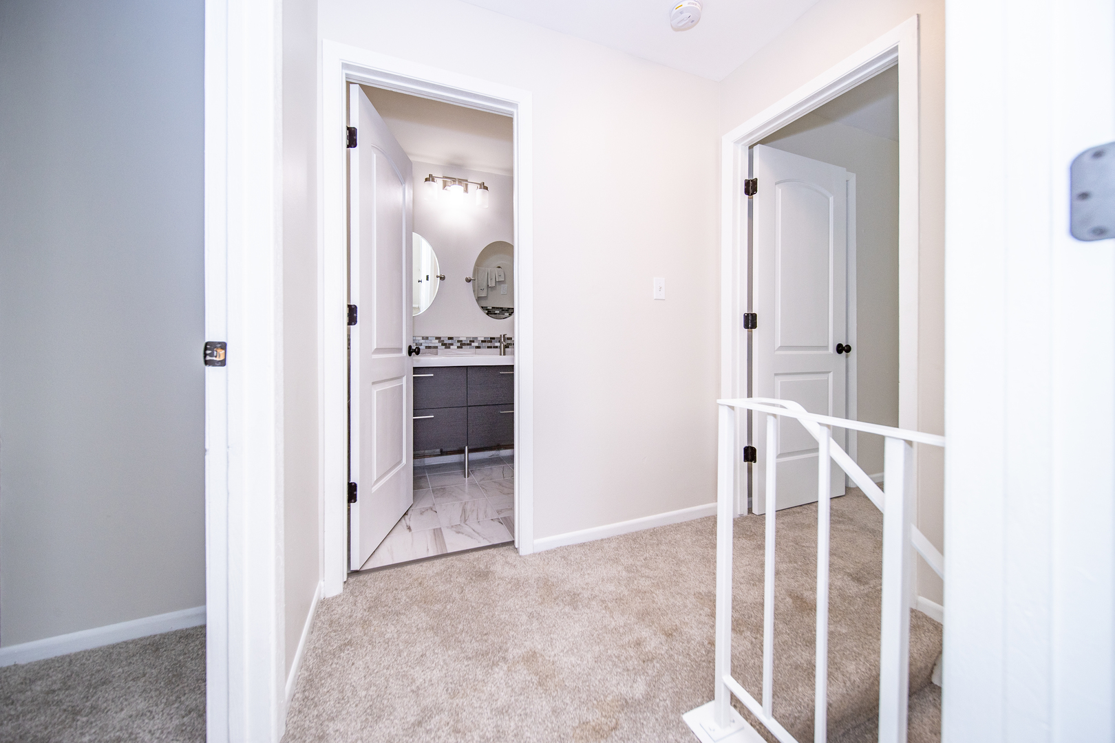 228 Butternut Lane Streamwood, IL 60107 - Photo 12 of 15 a view of a hallway with wooden floor and bathroom