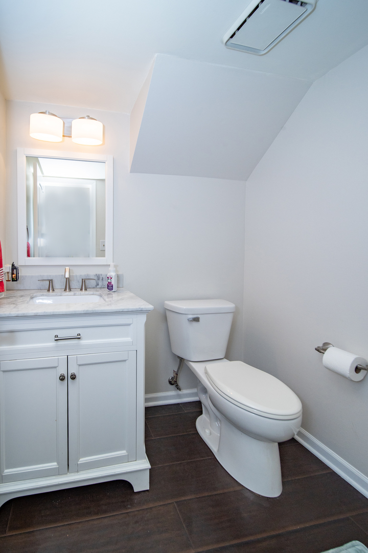 228 Butternut Lane Streamwood, IL 60107 - Photo 15 of 15 a bathroom with a sink toilet and mirror