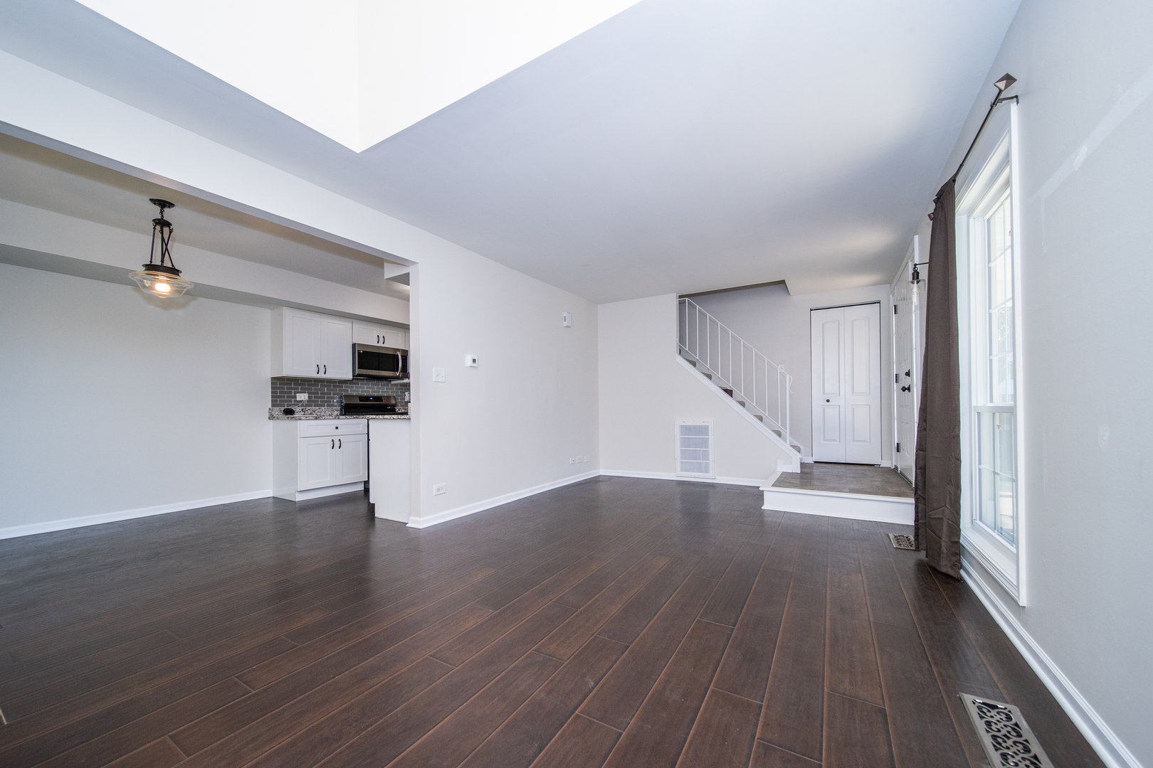 228 Butternut Lane Streamwood, IL 60107 - Photo 6 of 15 wooden floor in an empty room with a window