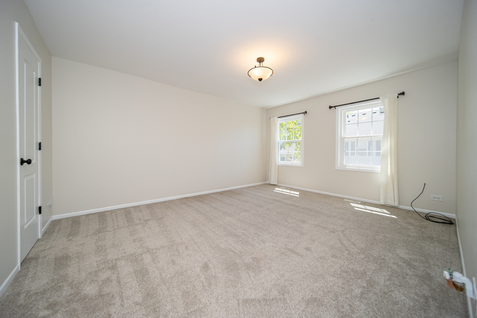 228 Butternut Lane Streamwood, IL 60107 - Photo 8 of 15 a view of an empty room with a window