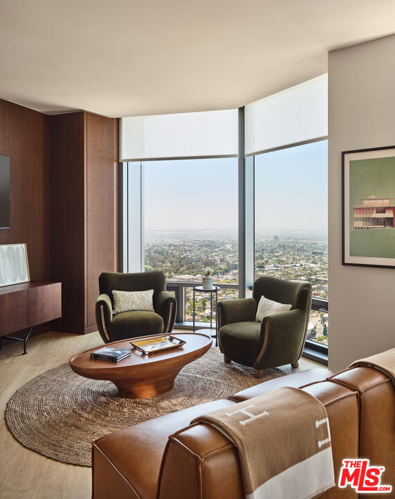 211 Elm Court, Unit 8D Los Angeles, CA 90067 - Photo 2 of 21 a living room with furniture and a floor to ceiling window