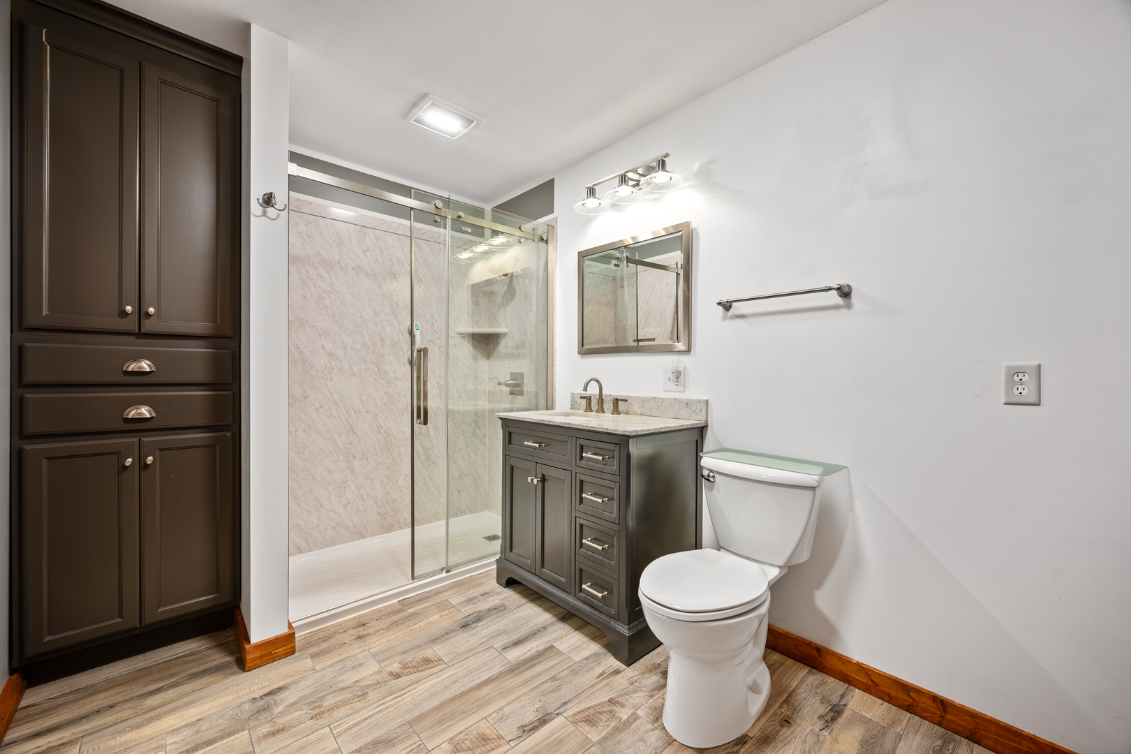 1540 East 950th Road Tonica, IL 61364 - Photo 8 of 38 a bathroom with a toilet a sink and mirror