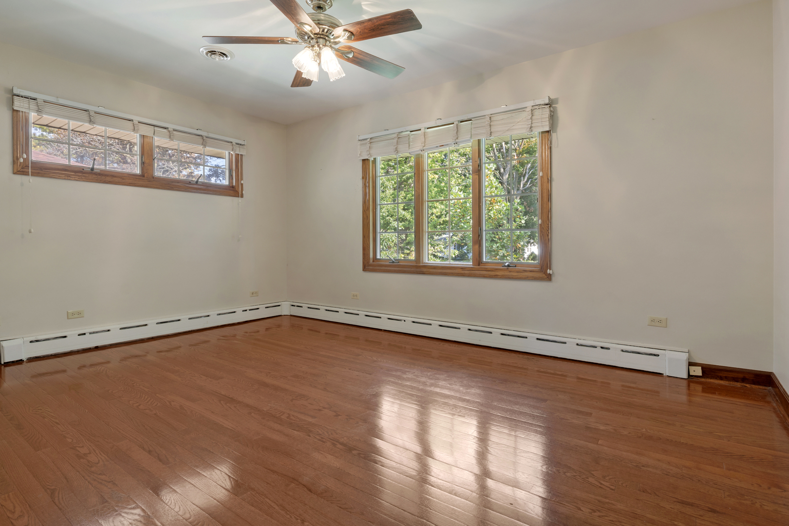240 Scott Avenue Glen Ellyn, IL 60137 - Photo 11 of 25 a view of an empty room with wooden floor and a window