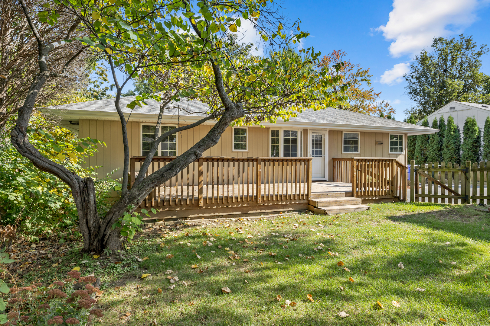 240 Scott Avenue Glen Ellyn, IL 60137 - Photo 21 of 25 a front view of a house with a garden