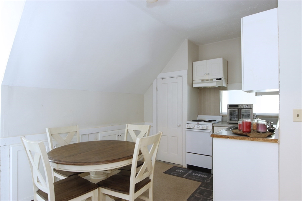 2 High Street Middleboro, MA 02346 - Photo 26 of 41 a kitchen with a sink a stove and white cabinets