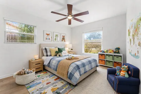 a bedroom with a bed and a window