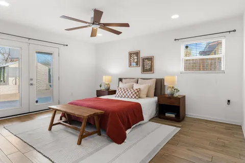 a bedroom with a bed and a table