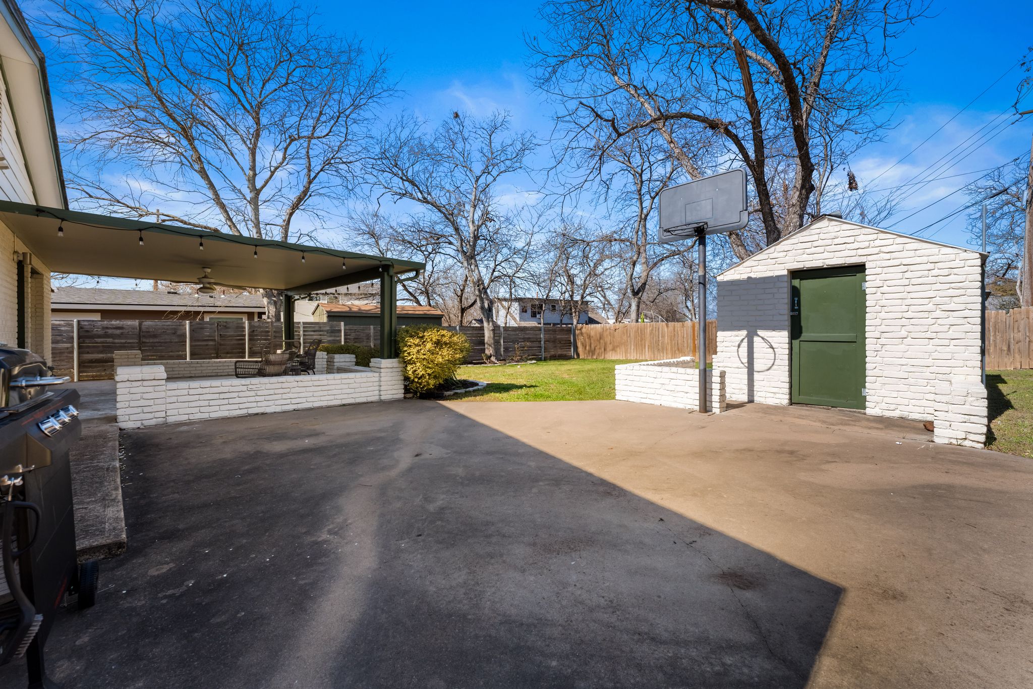 1900 Ohlen Road Austin, TX 78757 - Photo 28 of 34 Fenced backyard with a patio area, ceiling fan, area for grilling, and a shed