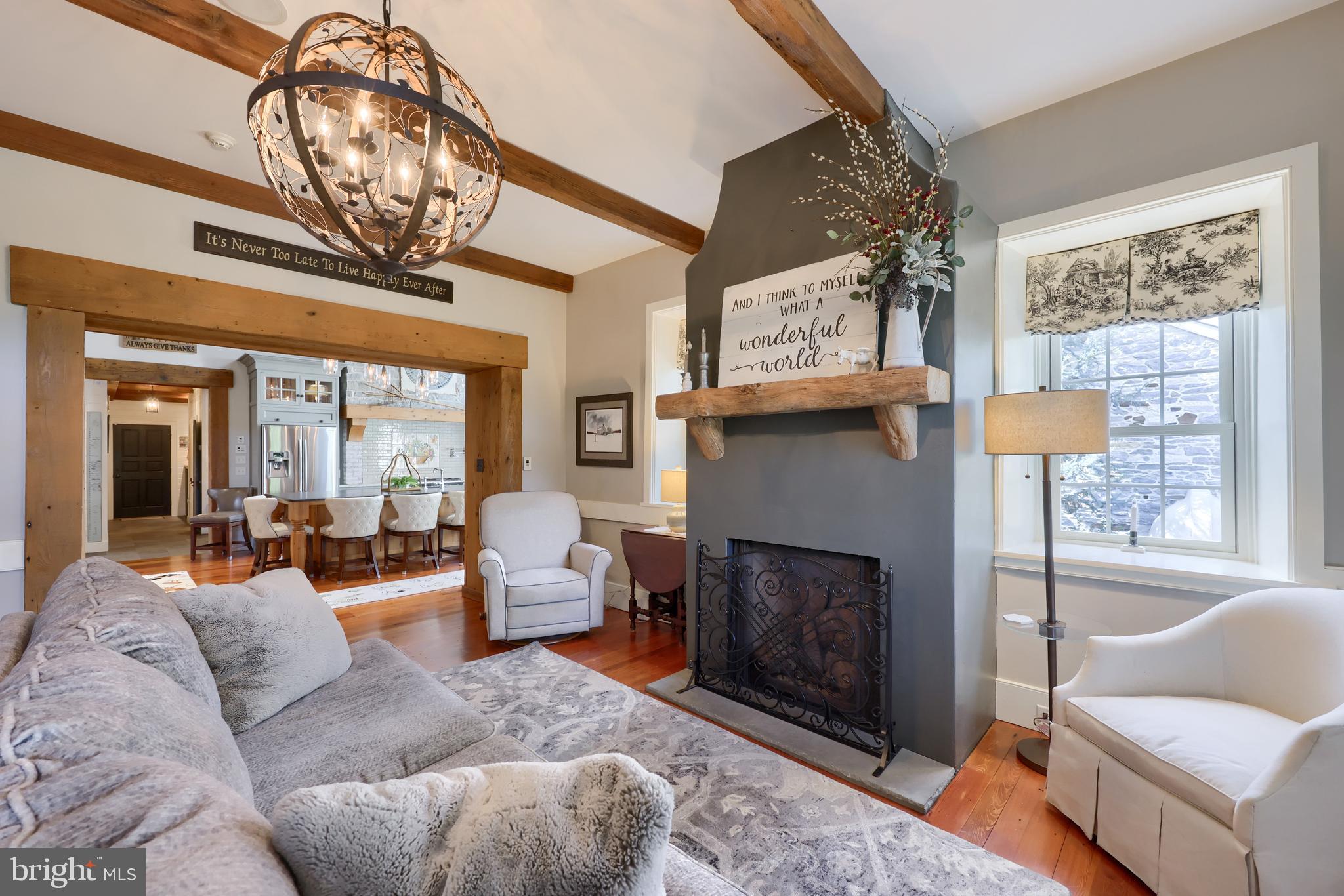 1610 Landis Road Mount Joy, PA 17552 - Photo 62 of 150 a living room with furniture a fireplace and a chandelier