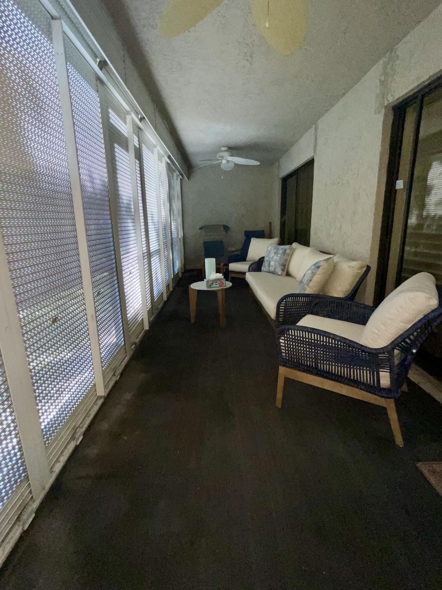 1210 Southeast Parkview Place, Unit 3 Stuart, FL 34994 - Photo 18 of 19 a living room with furniture and a window