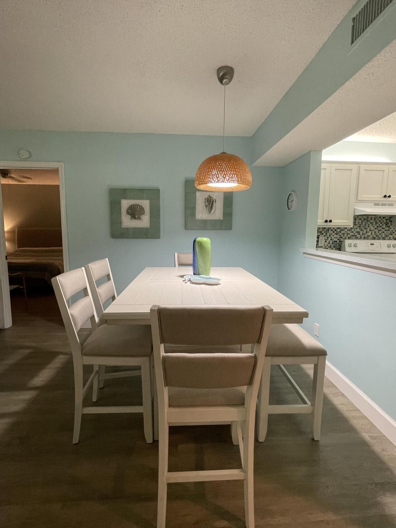 1210 Southeast Parkview Place, Unit 3 Stuart, FL 34994 - Photo 9 of 19 a dining room with furniture and window