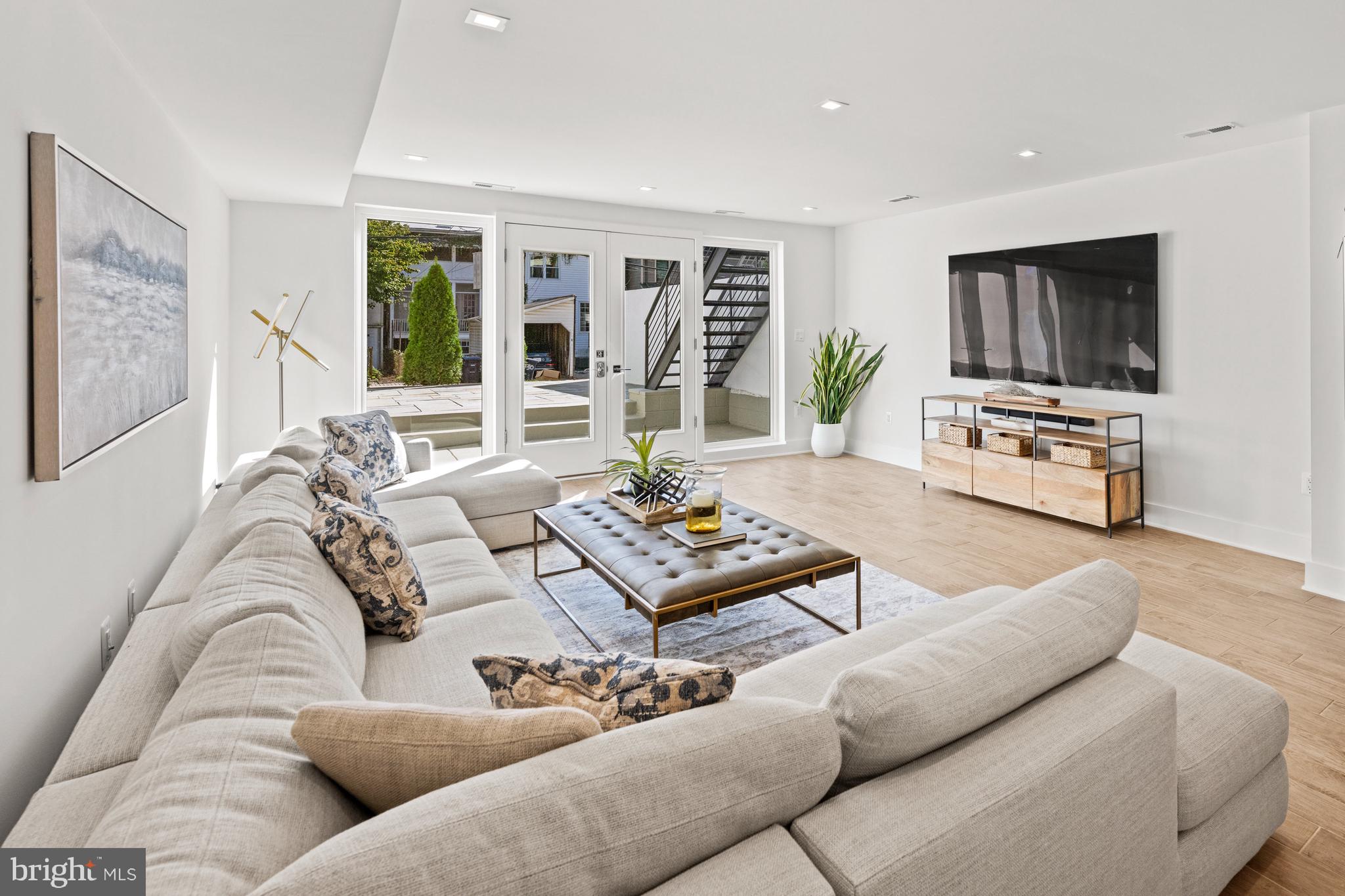 3728 R Street Northwest Washington, DC 20007 - Photo 7 of 34 Lower level living room - opens up to patio