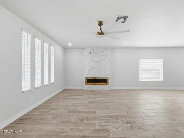 a large kitchen with a lot of counter space and stainless steel appliances