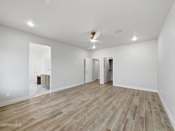 a large bathroom with a sink and a mirror