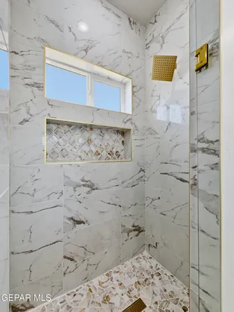 a large bathroom with a double vanity sink and a mirror