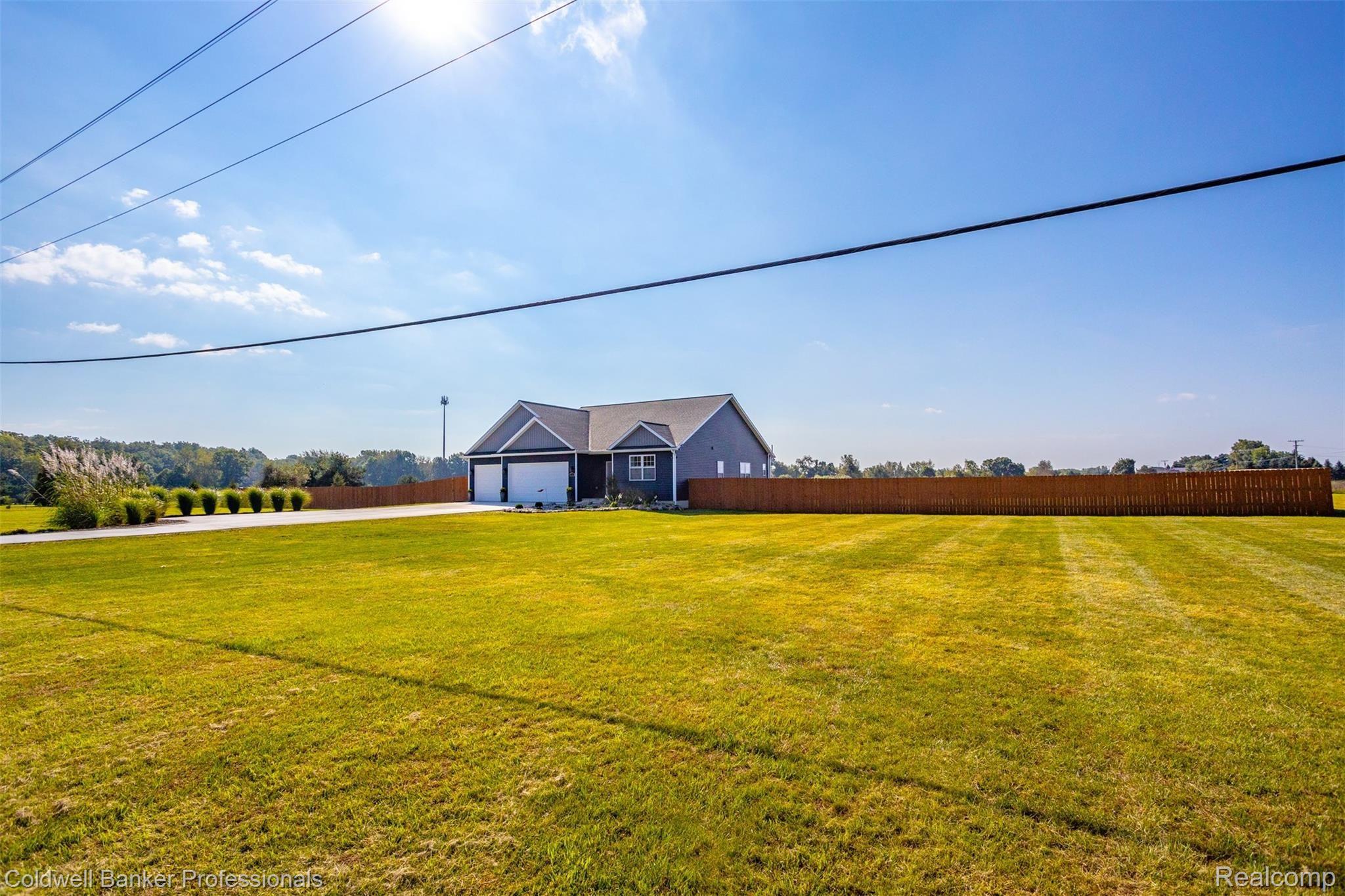3077 West Coon Lake Road Howell, MI 48843 - Photo 2 of 4 front yard and fencing.jpg