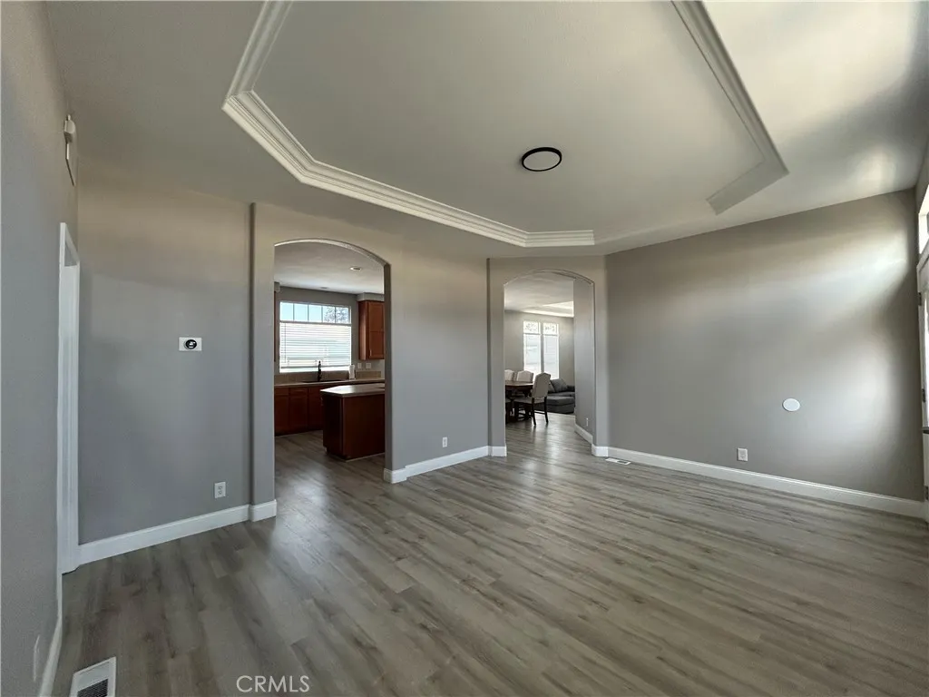 10550 Western, Unit 32 Stanton, CA 90680 - Photo 12 of 31 wooden floor in an empty room with a window