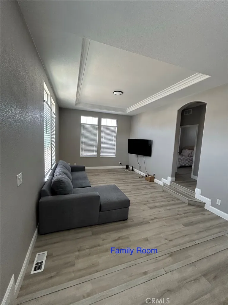 10550 Western, Unit 32 Stanton, CA 90680 - Photo 16 of 31 a living room with furniture and a flat screen tv