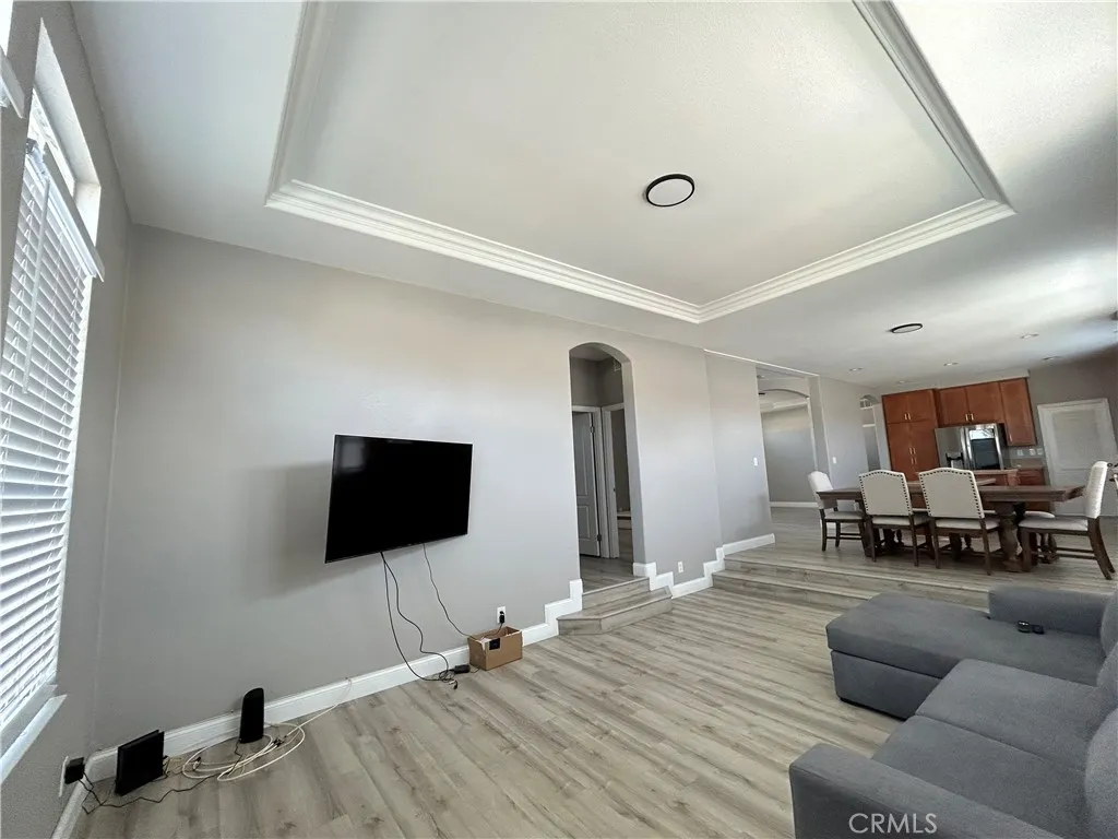 10550 Western, Unit 32 Stanton, CA 90680 - Photo 23 of 31 a living room with furniture and a flat screen tv