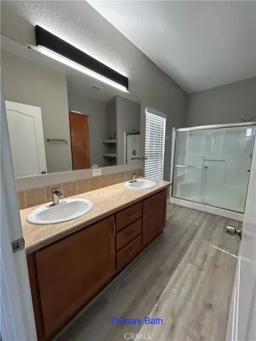 a bathroom with a double vanity sink mirror and double