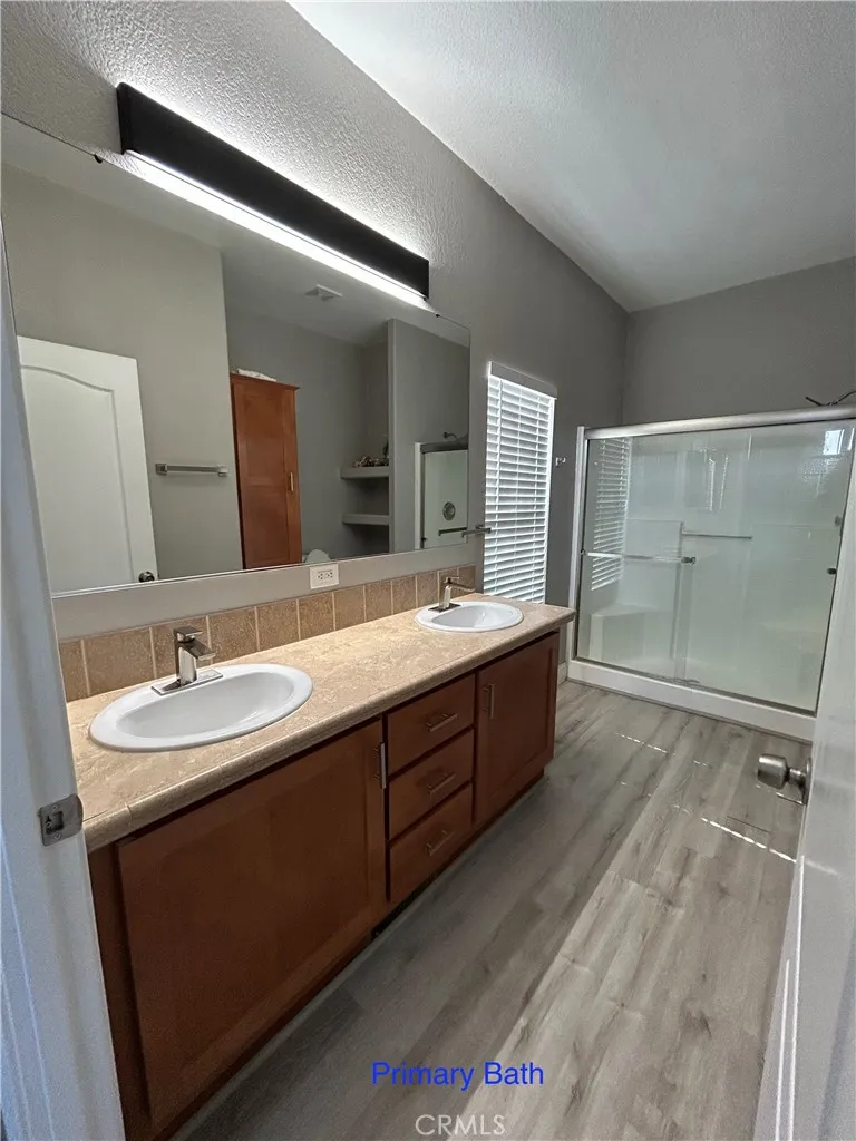 10550 Western, Unit 32 Stanton, CA 90680 - Photo 9 of 31 a bathroom with a double vanity sink mirror and double